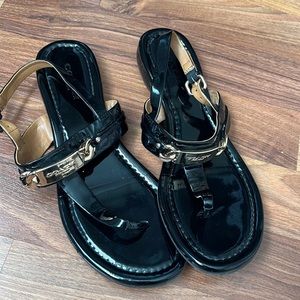 Coach black sandals with gold accents